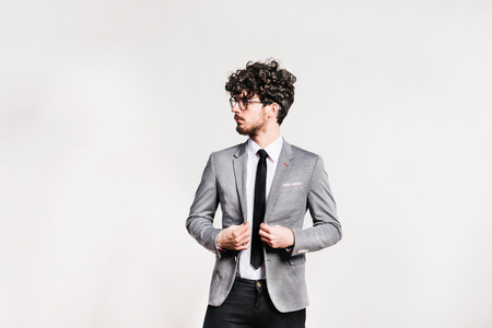 Portrait of a young man in a studio.の写真素材