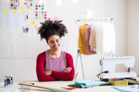 Young creative woman in a studio, startup business.の写真素材