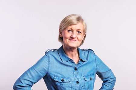 Portrait of a senior woman in studio.の写真素材