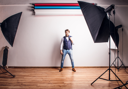 Portrait of a young hipster man in a studio.の写真素材