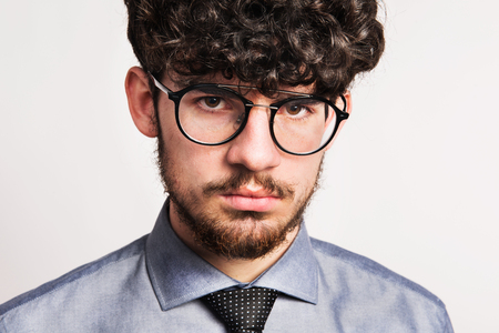 Portrait of a young man in a studio. Close up.の写真素材