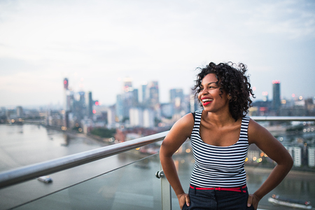 A portrait of businesswoman standing against London rooftop view panorama.の写真素材