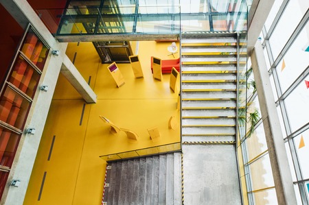 High-angle view of interior of a modern spacious library with computers for public.の写真素材