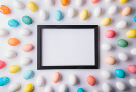 Eggs flat lay on a white background. Easter and spring composition. Copy space.の写真素材