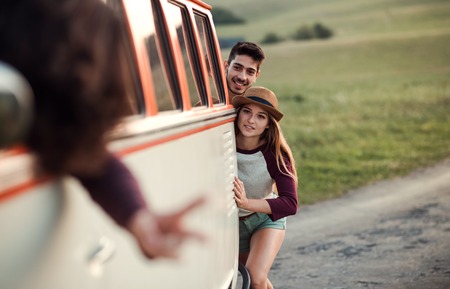 A group of young friends on a roadtrip through countryside.の写真素材