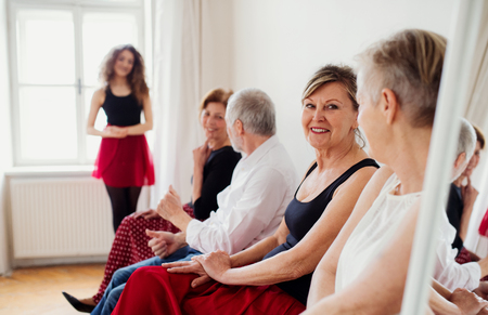Group of senior people in dancing class with dance teacher.の写真素材