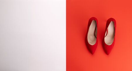 A studio shot of pair of high heel shoes on color background. Flat lay.の写真素材
