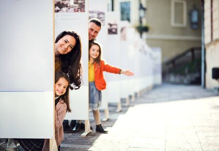 Family with children having fun in town in autumn, family time.の写真素材