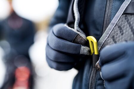Midsection of mountain biker on road outdoors in winter.の写真素材