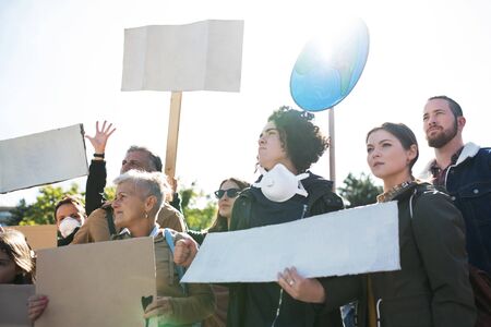 People with placards and posters on global strike for climate change.