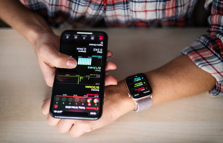 NOVA BANA, SLOVAKIA - NOV 12, 2019: New Apple Watch Series 5 and iPhone 11 Pro smartphone.のeditorial素材