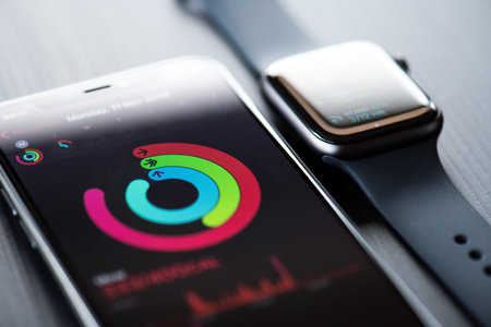 NOVA BANA, SLOVAKIA - NOV 12, 2019: New Apple Watch Series 5 and iPhone 11 Pro smartphone.のeditorial素材