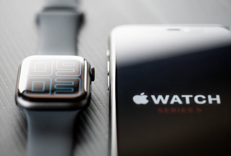 NOVA BANA, SLOVAKIA - NOV 12, 2019: New Apple Watch Series 5 and iPhone 11 Pro smartphone.のeditorial素材