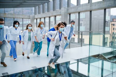 Group of doctors running in corridor of hospital, emergency concept.の写真素材