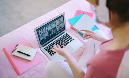 Unrecognizable young student with laptop, online lesson concept.