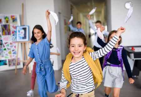Group of cheerful children going home from school after covid-19 quarantine and lockdown.の写真素材