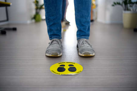 Midsedction of unrecognizable people waiting, coronavirus, covid-19 and safe distance concept.の写真素材