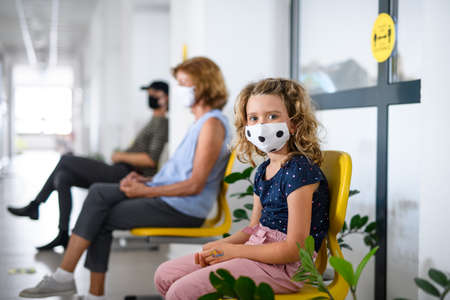 Portrait of child with face mask, coronavirus, covid-19 and vaccination concept.の写真素材