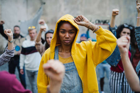 Group of people activists protesting on streets, BLM demonstration and coronavirus concept.