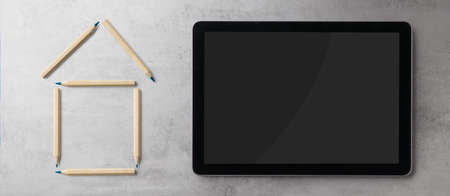 Flat lay top view of tablet and outline of house, housing concept. Copy space.の写真素材