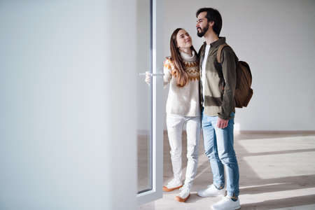 Young couple moving in new flat, new home and relocation concept.
