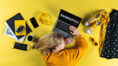 Top view of frustrated business woman at desk , coronavirus and bankruptcy desktop concept.の写真素材