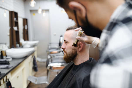 Man client visiting hairdresser in barber shop,  new normal concept.の写真素材