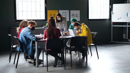 Group of people attending education class in community centerの写真素材