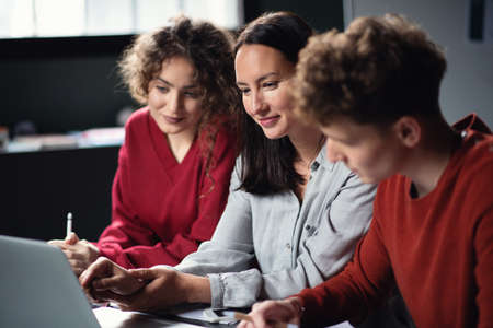 Group of young people attending education class in community center.の写真素材