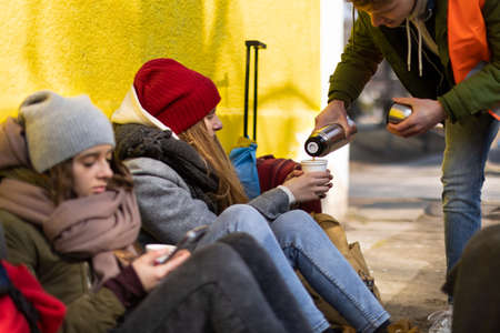 Ukrainian immigrants crossing border and getting food and drinks from volunteers.の写真素材