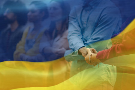 Double exposure of protestors protesting against war in Ukraine and Ukrainian flag.の写真素材