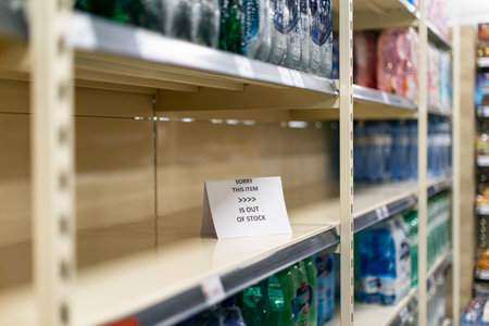 Empty shelves in a grocery store, sold out goods