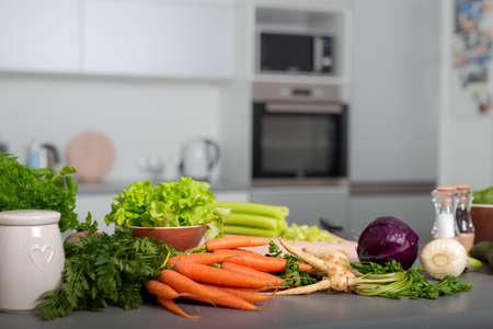Set of variety vegetable on kitchen counter bar. Healthy eating with vegetarian concepts.