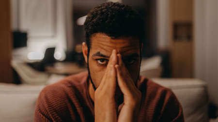 Portrait od sad young African - American man.