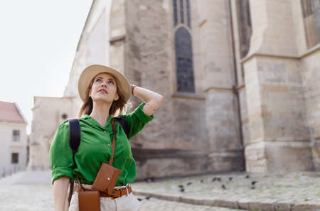 Young woman travel alone in old city centre.の写真素材
