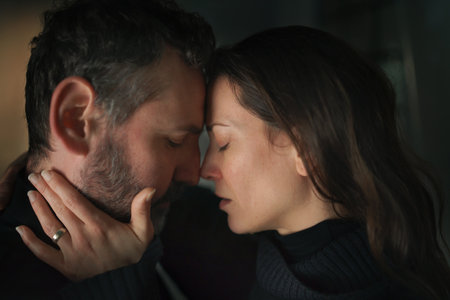 Close-up of woman crying when hugging her husband.