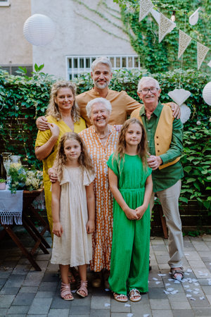 Multi-generation family on outdoor summer garden party, celebrating birthdayの写真素材