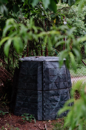 Plastic compost box in garden. Concept of waste separation, reusing of waste, fertilizer.の写真素材