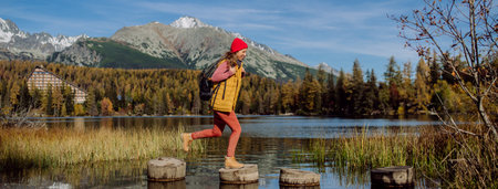 Side view of woman enjoying view at mountains.の写真素材