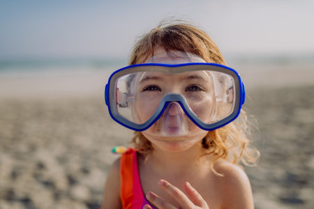 Portrait of little girl in snorkeling mask.の写真素材