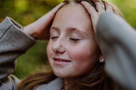Portrait of girl with closed eyes, outdoor in forest.の写真素材