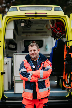 Portrait of doctor standing in front of ambulance car.の写真素材