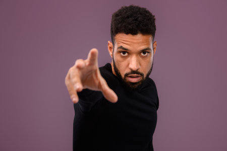 Portrait of young multiracial man in studio.の写真素材