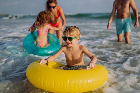 Happy family with little kids enjoying time at sea in exotic country.の写真素材