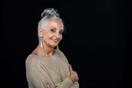 Portrait of happy well dressed senior woman, celebrating concept.