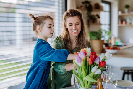 Little girl with her mother celebrating spring.の写真素材