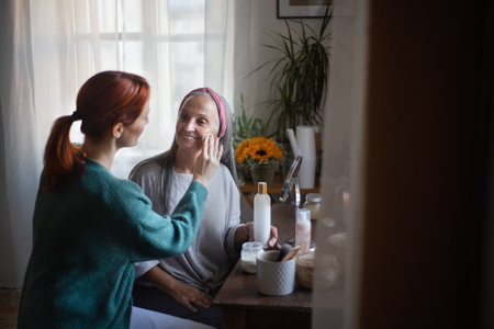 Caregiver helping her client with a make up.の写真素材