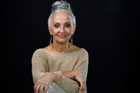 Portrait of happy well dressed senior woman, celebrating concept.