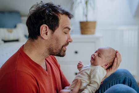 Close-up of father holding his little son.