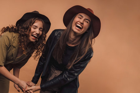 Portrait of two young happy girls, studio shoot,の写真素材